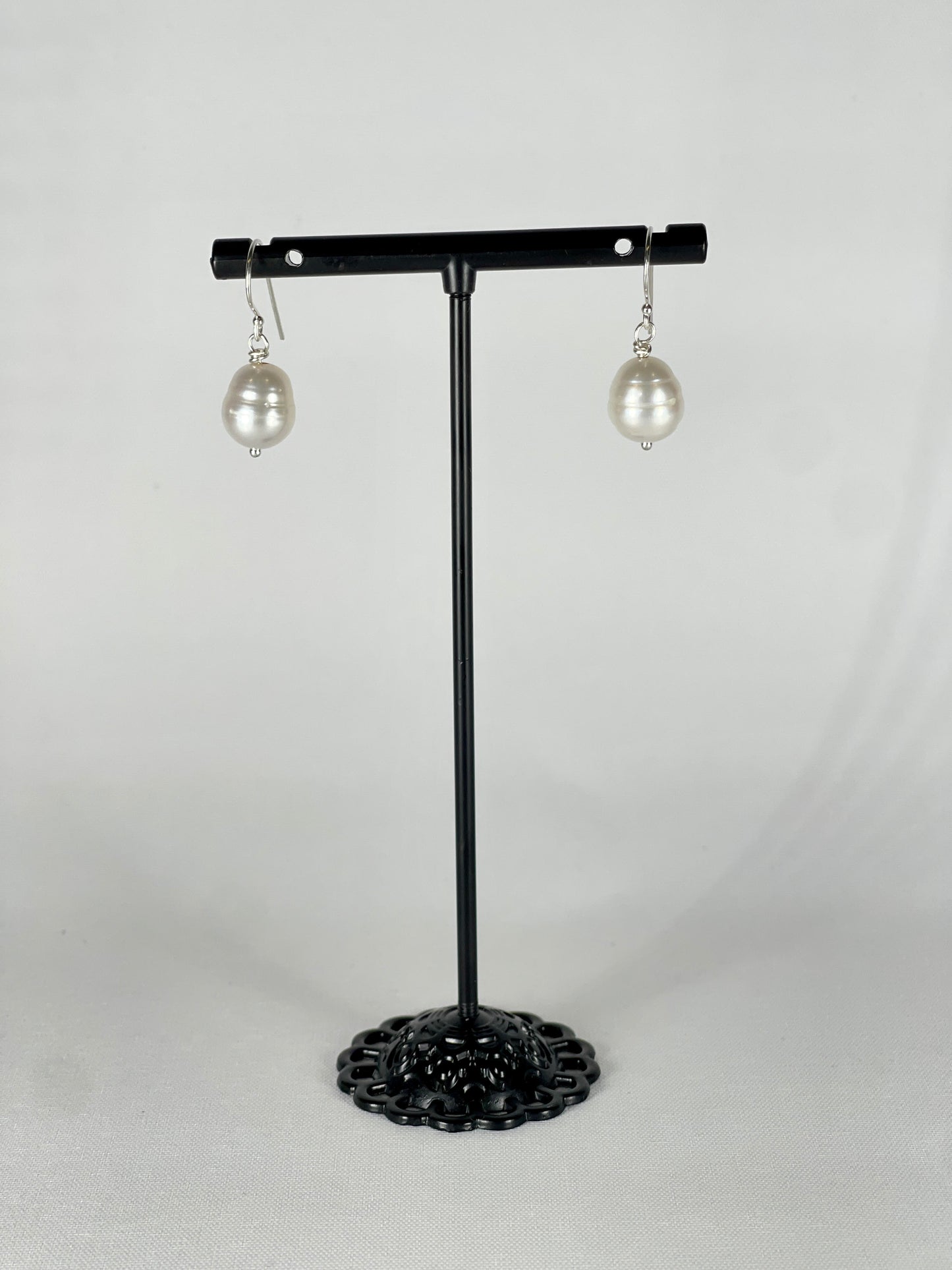 Silver single drop earrings with a white round pearl