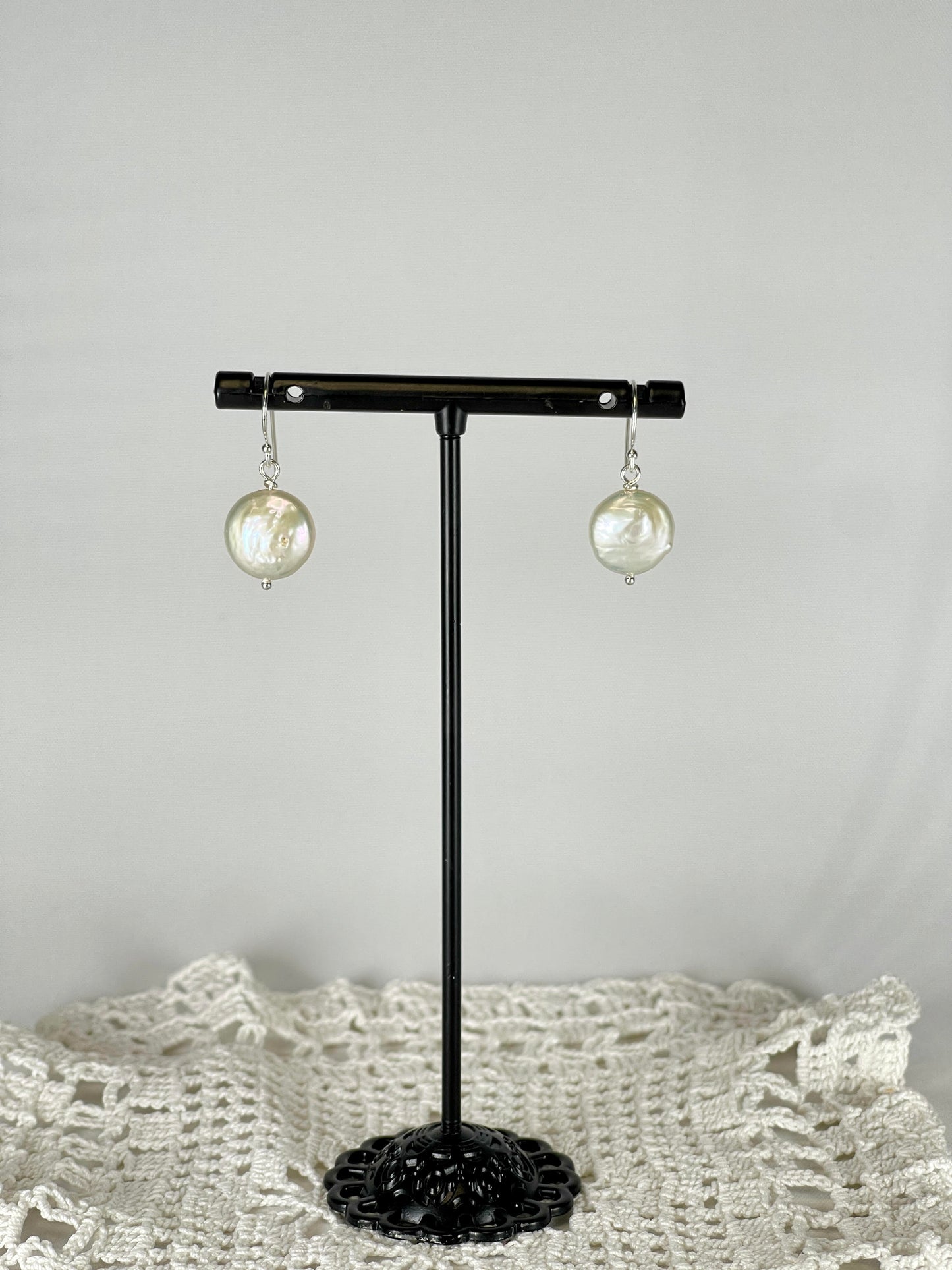 Silver single drop earrings with a which coin pearl
